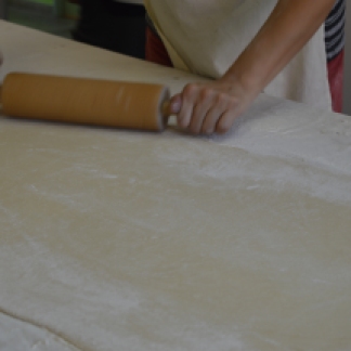 The dough has to be rolled out evenly to ensure the right shape of the strudel.